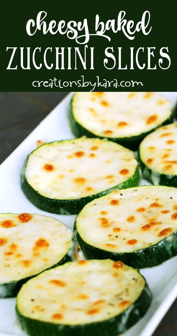 cheesy baked zucchini slices on a white plate with text overlay