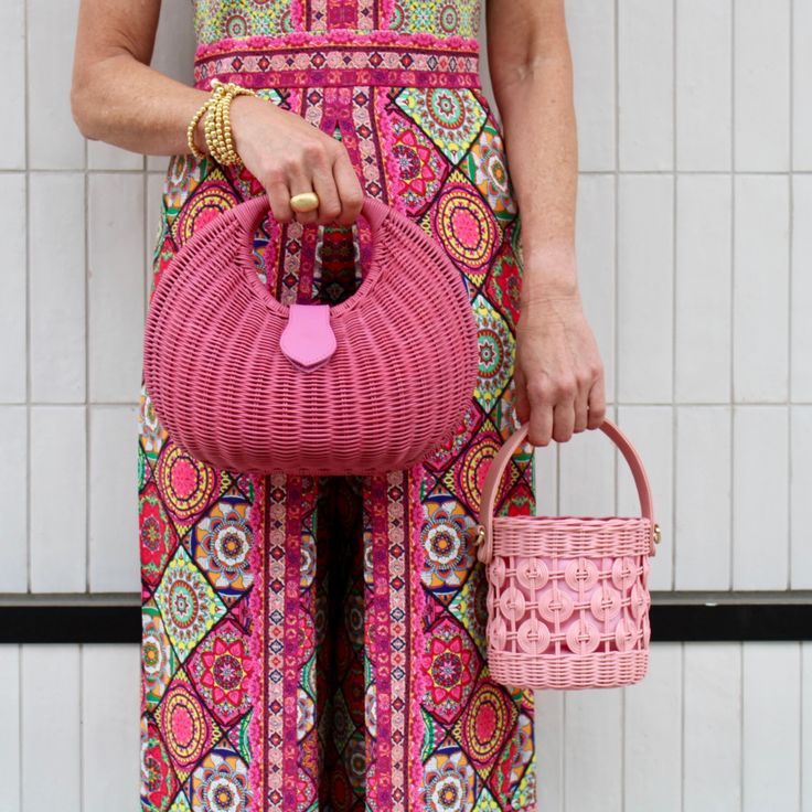 Add a pop of color to your summer accessories collection with this fun and fabulous bag! This chic wicker bucket bag features a leather handle and removable crossbody strap. Product Overview: Materials: wicker, cotton, lambskin, gold hardware Size: 6’’ H (4’’ handle drop) x 5.5’’ W Chic Straw Crossbody Bag With Detachable Handle, Chic Crossbody Straw Bag With Detachable Handle, Chic Straw Bag With Bamboo Handle, Spring Woven Leather Top Handle Bag, Chic Woven Leather Straw Bag With Top Handle, Spring Top Handle Bag In Woven Leather, Chic Straw Bag With Leather Handles, Chic Straw Bag With Detachable Handle For Day Out, Chic Crossbody Straw Bag With Leather Handles