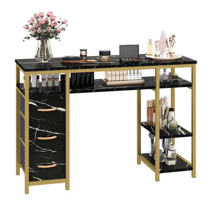 a black and gold computer desk with flowers on the top, bookshelf below