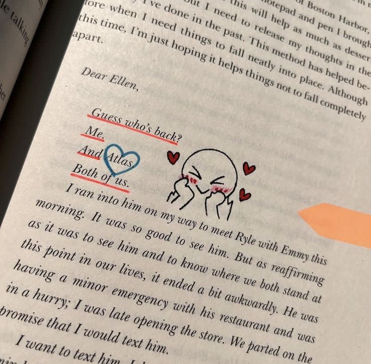 an open book with stickers on the pages