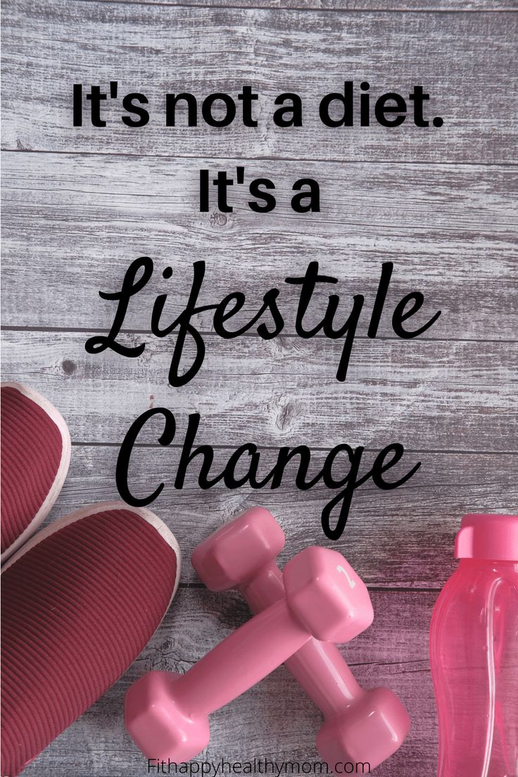 a pair of pink dumbs next to a bottle with the words it's not a diet, it's a lifestyle change