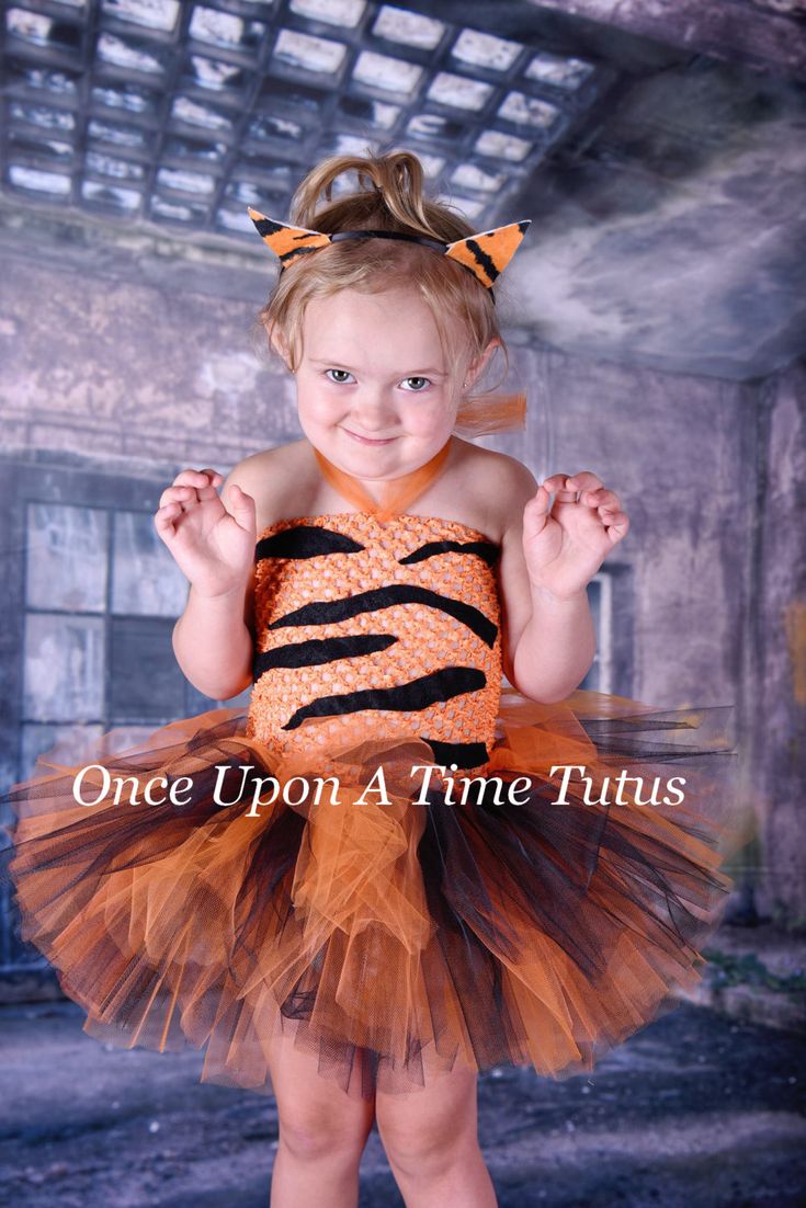 Tiger Tutu Dress An orange and black colored tutu made onto an orange tutu top is perfect outfit for Halloween pictures and costumes! Adorned with felt tiger stripes, this is the perfect Halloween or pageant outfit. Perfect for baby's first Halloween! (Headband sold separately in the drop down menu) Great for baby showers, photo props, portraits, special occasions, and birthdays! Sizes: Length noted is tutu portion only. Top will be an additional 6-12 inches, depending on size ordered. Newborn - Halloween Costume Kids, Up Halloween Costumes, Pageant Outfits, Tiger Costume, Baby Kostüm, Infant Baby Girl, Baby First Halloween, Dress Infant, Wild Tiger