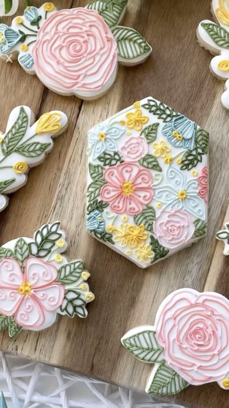 some decorated cookies are sitting on a table