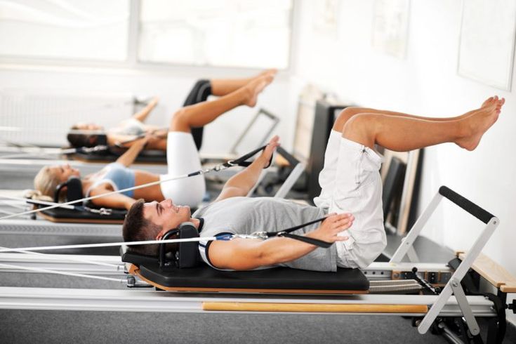 there are many people doing exercises on the treadmills