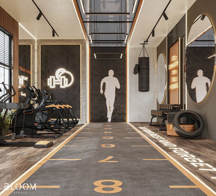 an indoor gym with treadmills, exercise bikes and mirrors on the walls that are lit up