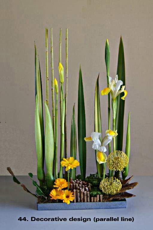 an arrangement of flowers is displayed on a table