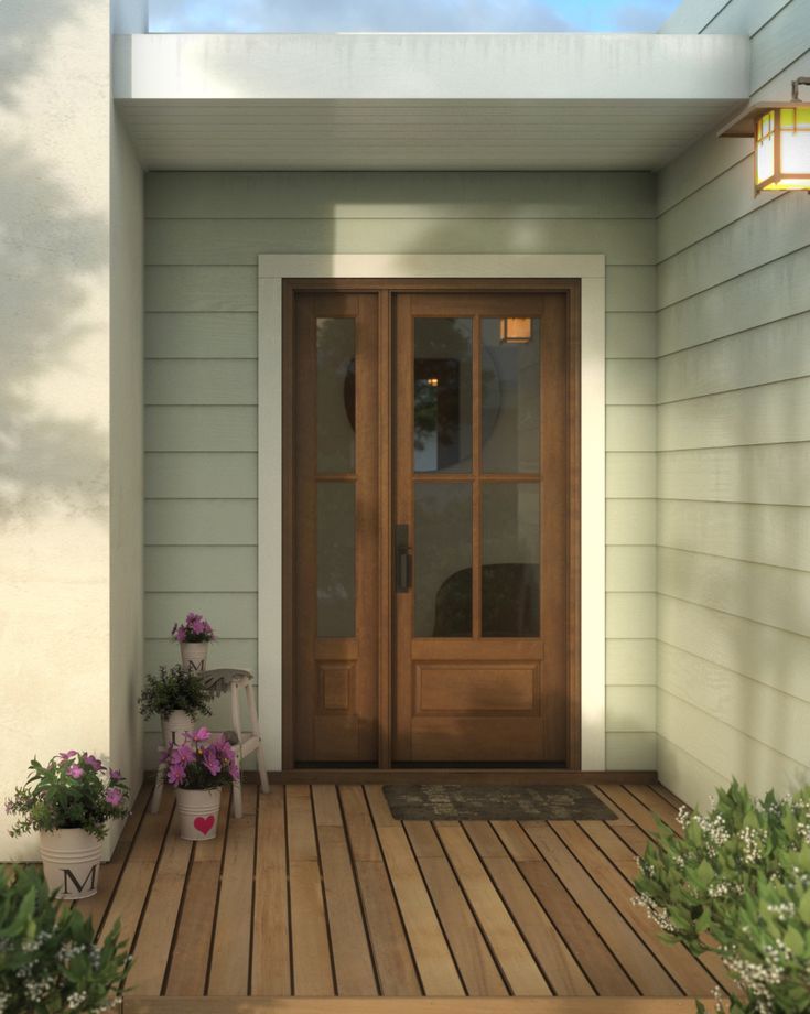 the front door of a house with potted plants