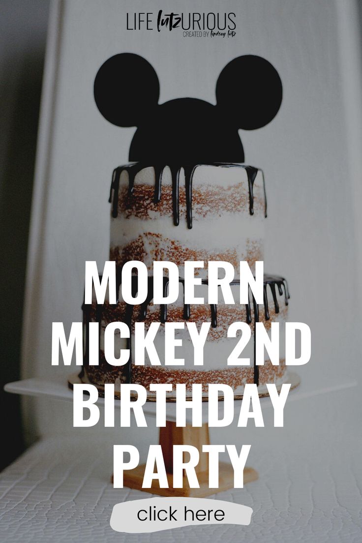 a mickey mouse cake with the words modern mickey 2nd birthday party on it's side