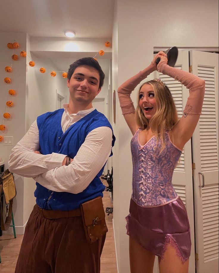 a man and woman dressed up in costumes