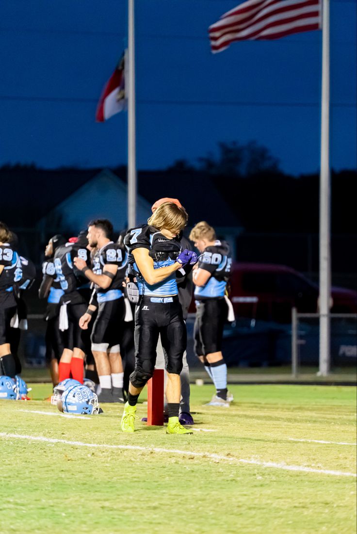 Picture of football players standing on the field Journalism Ideas, Football High School, School Football Game, High School Football Games, Football Photography, Night High, High School Sports, High School Football, School Football