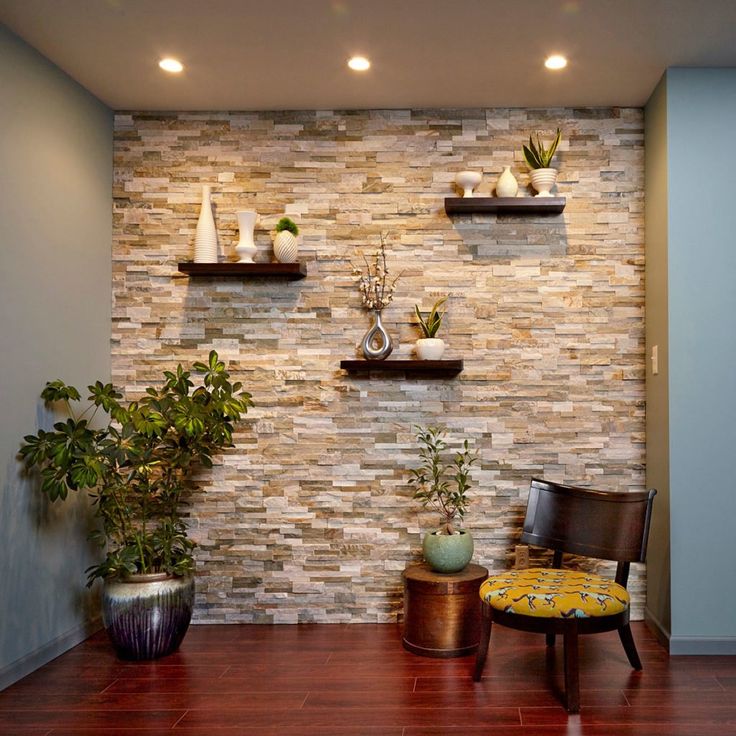 a room with some shelves and plants on the wall