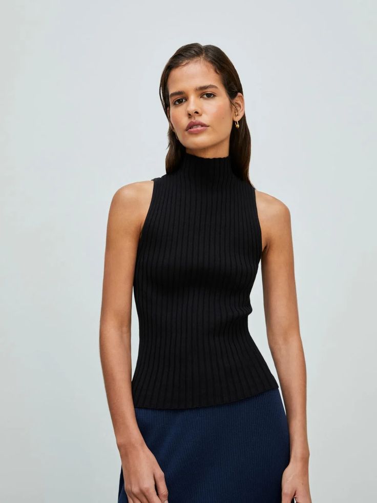 Chic High Neck Knit Top For Spring, Spring Chic High Neck Knit Top, Chic Ribbed Turtleneck Knit Top, Chic Ribbed Fitted Mock Neck Top, Chic Ribbed Mock Neck Top, Chic Ribbed Turtleneck Tops, Trendy Turtleneck Knit Top For Work, Ribbed Turtleneck Tank Top, Modern Turtleneck Top For Layering