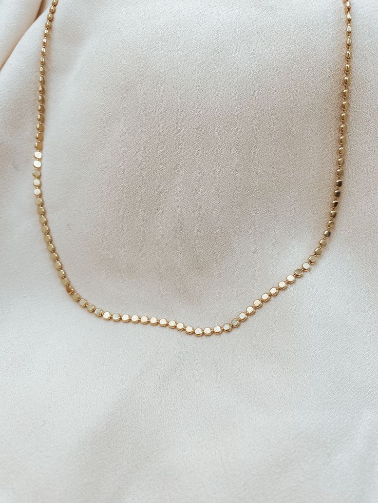 Our beautiful Dot Chain is an easy way to make a big statement and is perfect to wear anytime. This chain looks beautiful on its own or mixed and matched. High quality chain necklace, gold filled, nickel-free and hypoallergenic.This’s one of my favorite chains from my new collection. The different shapes make them look so classy, unique, and shiny! YOU’LL LOVE IT!! DETAILS: •Material: 14K gold-filled, sterling silver •Lengths : 14" - 18" inches • Thickness: 2mm•features the perfect chain for mak Everyday Silver 14k Gold Filled Chain Necklace, Dainty Gold Chain Round Necklaces, Minimalist Silver Chain Necklace 14k Gold Filled, Minimalist Silver 14k Gold Filled Chain Necklace, Minimalist 14k Gold Filled Silver Chain Necklace, Dainty Round Gold Chain Necklace, 14k Gold Silver Chain Necklace With Delicate Chain, 14k Gold Delicate Silver Chain Necklace, 14k Gold Delicate Chain Necklace In Silver