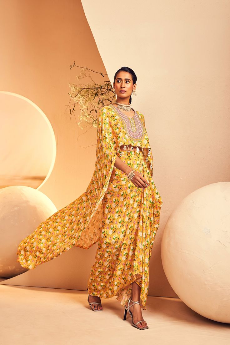 featuring a high-low top paired with a draped dhoti skirt in a modern floral print. The neckline is embroidered fully by hand with intricate Japanese cutdana and bead embroidery. From Aneesh Agarwaal's Naksh collection. DELIVERY TIMEPlease allow 8-12 weeks for your outfit to arrive. FABRIC DETAILSCrepe Professional cleaning only. Dhoti Skirt, High Low Top, 12 Weeks, Modern Floral, Professional Cleaning, Bead Embroidery, Beaded Embroidery, Skirt Length, Low Top