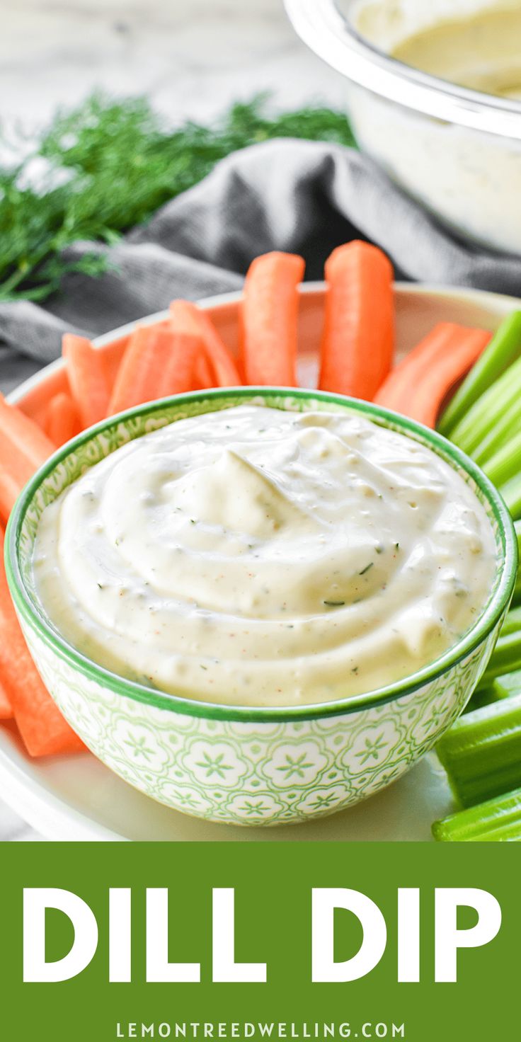 dip in a bowl surrounded by carrots and celery on a white plate