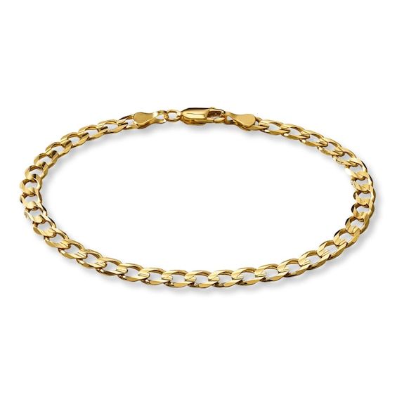 This 8.5-inch curb link bracelet offers an appealing look. Crafted in solid 10K yellow gold, this fine jewelry bracelet is secured with a lobster clasp. 14k Gold Cuban Link Bracelet With Curb Chain, Yellow Gold Link Charm Bracelet With Curb Chain, Yellow Gold Charm Bracelet With Curb Link Chain, 14k Gold Bracelet With Curb Chain Oval Link, 14k Gold Bracelet With Oval Link Curb Chain, 14k Gold Charm Bracelet With Curb Chain, Yellow Gold Cuban Link Bracelet With Curb Chain, Classic Yellow Gold Charm Bracelet With Curb Chain, Yellow Gold Cuban Link Bracelet With Lobster Clasp