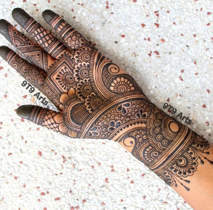 a henna tattoo is shown on someone's hand