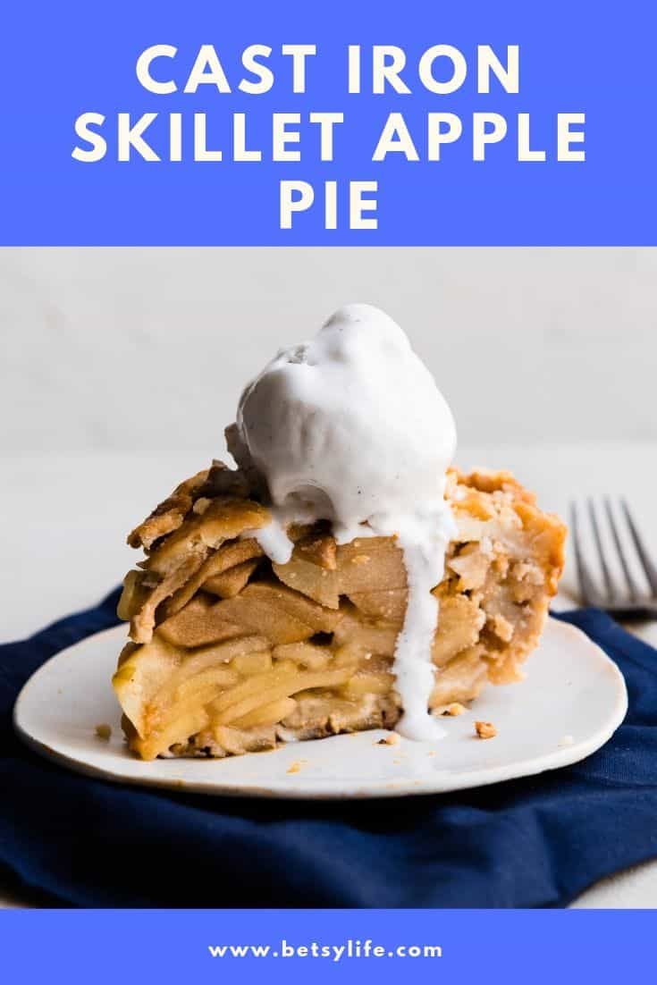 a slice of cast iron skillet apple pie on a white plate with whipped cream