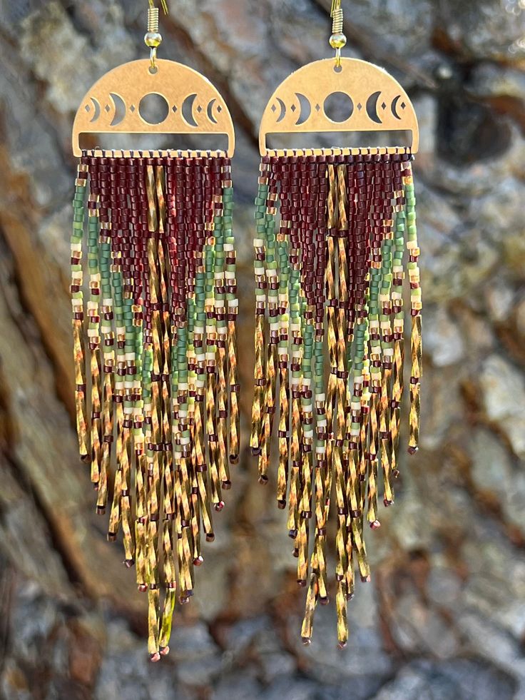 Handmade bohemian beaded fringe earrings. Bohemian Brown Tassel Earrings, Brown Bohemian Tassel Earrings, Bohemian Chandelier Earrings With Fringe And Round Beads, Bohemian Chandelier Earrings With Beaded Fringe, Beaded Fringe Dangle Tassel Earrings For Festival, Festival Fringe Earrings With Round Beads, Bohemian Tassel Earrings With Fringe, Artisan Dangle Tassel Earrings With Fringe, Artisan Tassel Dangle Earrings With Fringe