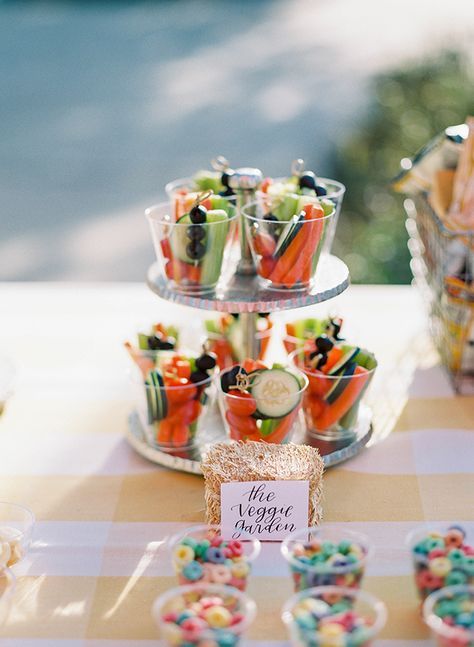 a table topped with lots of cupcakes and desserts on top of it