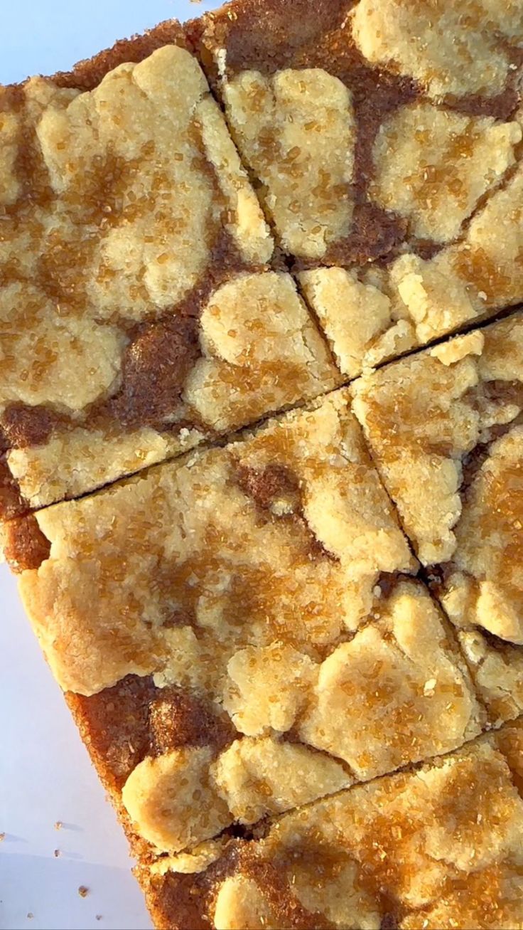 a square piece of cake sitting on top of a white plate