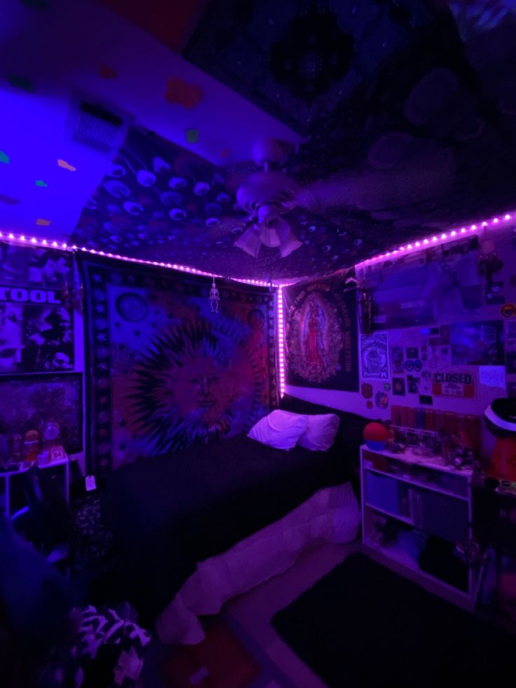 a bed room with a neatly made bed and purple lights