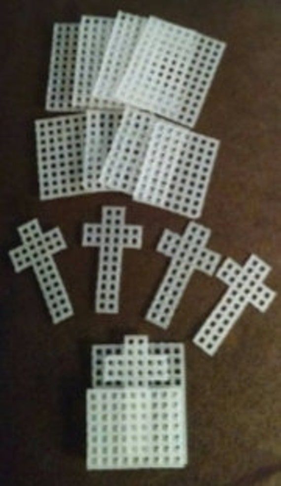 several pieces of white plastic that have been placed on the floor with holes in them