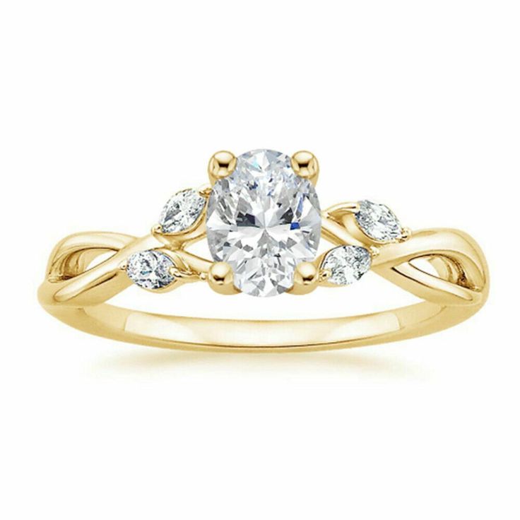 a yellow gold engagement ring with an oval cut diamond