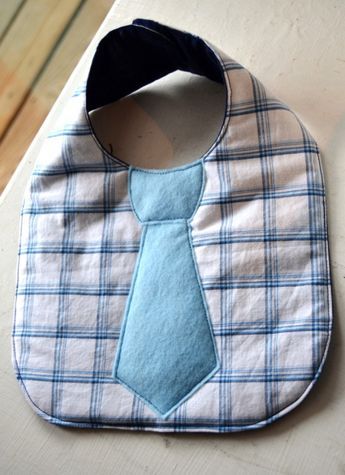 a bib with a blue tie on it