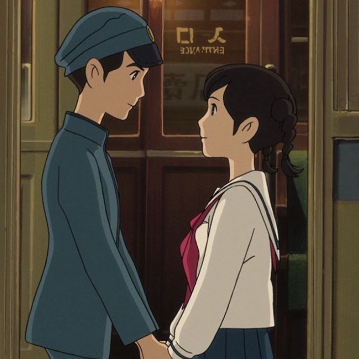 an animated image of two people standing in front of a train station door, one holding the hand of another person's hand