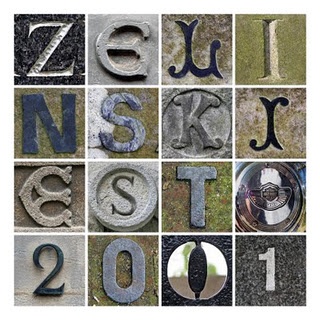 the letters and numbers are made up of different types of concrete blocks, including one that has