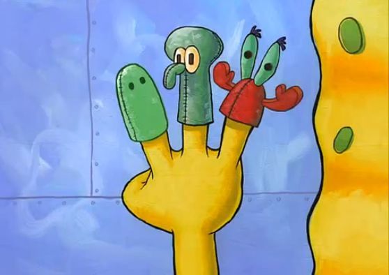 a cartoon hand with two fingers holding something up to the camera, and another person's head sticking out from behind it