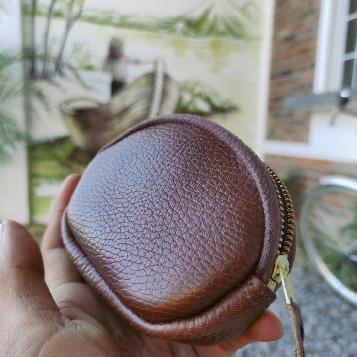 Ideal for quick trips or outdoor activity, our Zip Leather Coin Purse is for those who like to keep things simple and only need to carry the essentials. Handmade by leather artisans on Lake Atitlan, the zip coin purse is constructed with a golden YKK zipper attached with a hand-stitched leather puller to facilitate opening. The full-grain pebbled black leather develops a smooth, much-desired patina with use. Specs Length: 4.5´´ Height: 3.5´´ Depth: 1.0''Material: Full-grain bovine leather Wallet With Coin Pocket For Everyday Carry, Everyday Carry Wallet With Coin Pocket, Brown Wallet With Zipper Pouch, Versatile Leather Coin Purse With Zipper, Zipper Pouch Coin Purse For Everyday Use, Everyday Use Coin Purse With Zipper Closure, Everyday Carry Pouch With Coin Pocket, Portable Leather Pouch Wallet, Brown Pouch With Coin Pocket For Daily Use