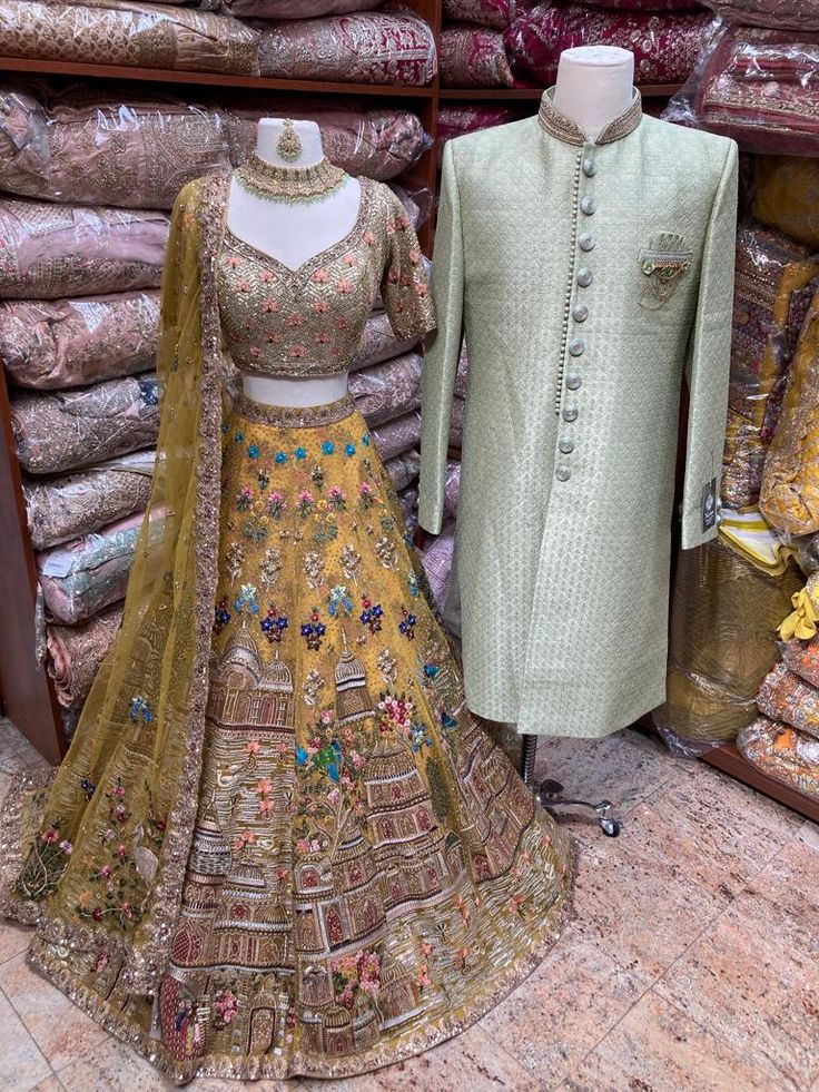 Mens Sherwani: sage green brocade sherwani with embroidered buttons and with a broach. Womens Lehenga: Lemonade Yellow manifesting beautiful jaal of flowers, temple and figurines motifs enriched with intricate embroidery of sequins, thread, pearl, cutdana & stone work enchants royalness. Teamed with similarly embroidered blouse and net dupatta with embroidered borders. Embroidered Buttons, Mens Sherwani, Matching Outfit, Indian Bridal Outfits, Tomboy Style Outfits, Net Dupatta, Stone Work, Tomboy Fashion, Sherwani