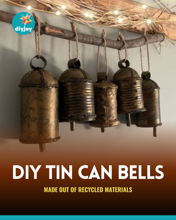 there are three metal bells hanging from the wall with string lights on it and an ad that says diy tin can bells made out of recycled materials