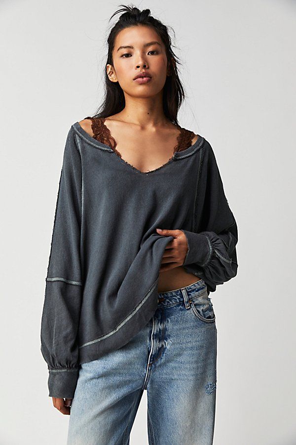 Just as effortless as it is essential, this so cool tee is featured in an oversized, slouchy fit with dropped shoulders, exposed seaming, and distressing at neckline for a true lived-in look. **Fit:** Relaxed, oversized fit **Features:** V-neckline, dropped shoulders, exposed seaming, side slits at bottom, exaggerated sleeves **Why We | Wish I Knew Tee by Free People in Black, Size: S Trendy Slouchy Tops For Everyday, Trendy Frayed Hem Tops For Loungewear, Trendy Loungewear Tops With Frayed Hem, Oversized Tops With Frayed Hem For Layering, Oversized Tops For Layering With Frayed Hem, Relaxed Fit Tops With Frayed Hem For Loungewear, Relaxed Tops With Frayed Hem For Loungewear, Relaxed Fit V-neck Tops With Frayed Hem, Oversized Ripped Crew Neck Top