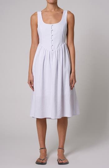 This lightweight, linen-kissed midi is designed in a sleeveless silhouette with a flared skirt. Side zip closure Front button closure Scoop neck Sleeveless Unlined 55% viscose, 45% linen Machine wash, line dry Imported Unlined A-line Midi Dress For Summer, Summer Feminine Linen Midi Dress, Daytime Linen Sleeveless Sundress, Sleeveless Linen Sundress For Daytime, Linen Sleeveless Sundress For Daytime, Chic Sleeveless A-line Linen Dress, Unlined A-line Linen Dress For Daywear, Feminine Linen Midi Dress For Daywear, Daywear Unlined Midi Linen Dress