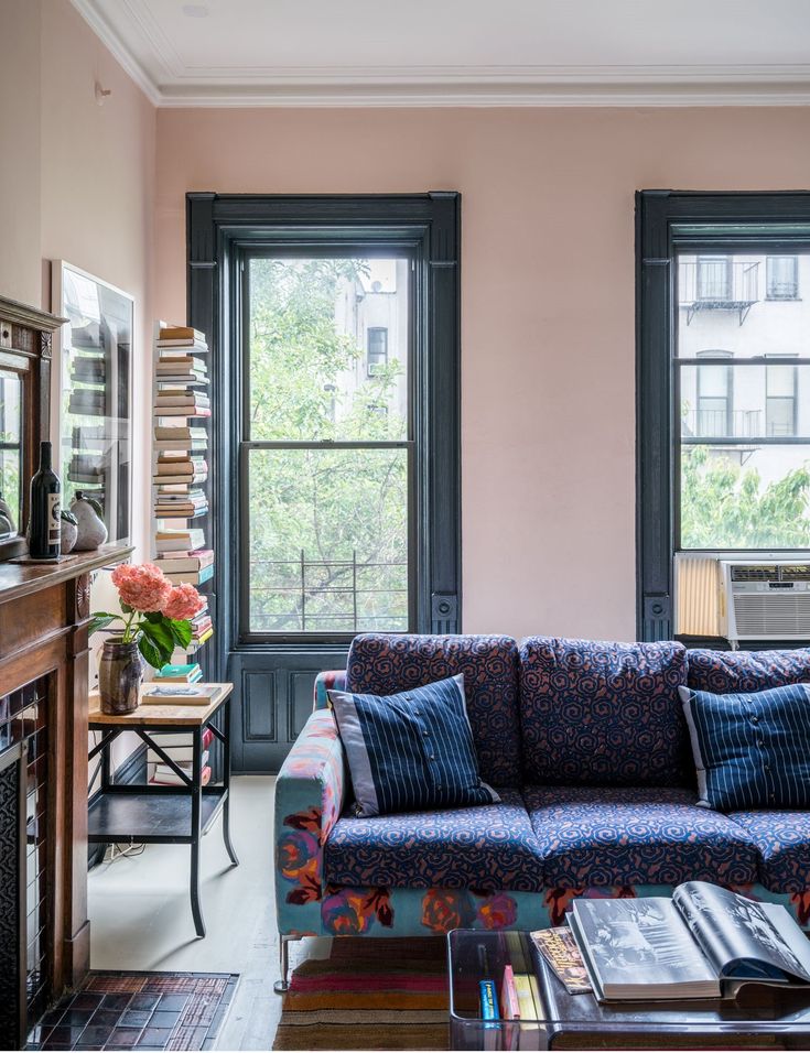 a living room filled with furniture and windows