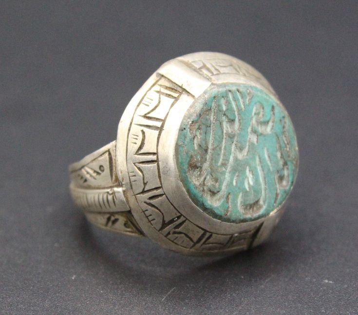 Afghan Turkmen traditional silver mughal hand made ring. Beautiful Arabic scripture, compressed Malachite stones and partial gold wash. Please do not hesitate to contact if you have any questions about items or further information. Measures :  Size of the ring : 8 US Jewelry Ring Mandrel, Weight : 7.4 Grams, Shipping & Estimated Delivery Time With Turkish Registered Post, Destination CountryStandard Shipping (business days) United States          15-20  Europe7-15 Asia15-25  Australia15-20 Brazi Traditional Hallmarked Engraved Ceremonial Ring, Traditional Carved Rings For Ceremonial Occasions, Traditional Ceremonial Engraved Hallmarked Ring, Traditional Carved Ceremonial Rings, Traditional Silver Signet Ring For Ceremonial Use, Traditional Green Rings, Traditional Sterling Silver Engraved Ring For Ceremonial Occasions, Traditional Green Hallmarked Rings, Traditional Silver Turquoise Ring With Inlay