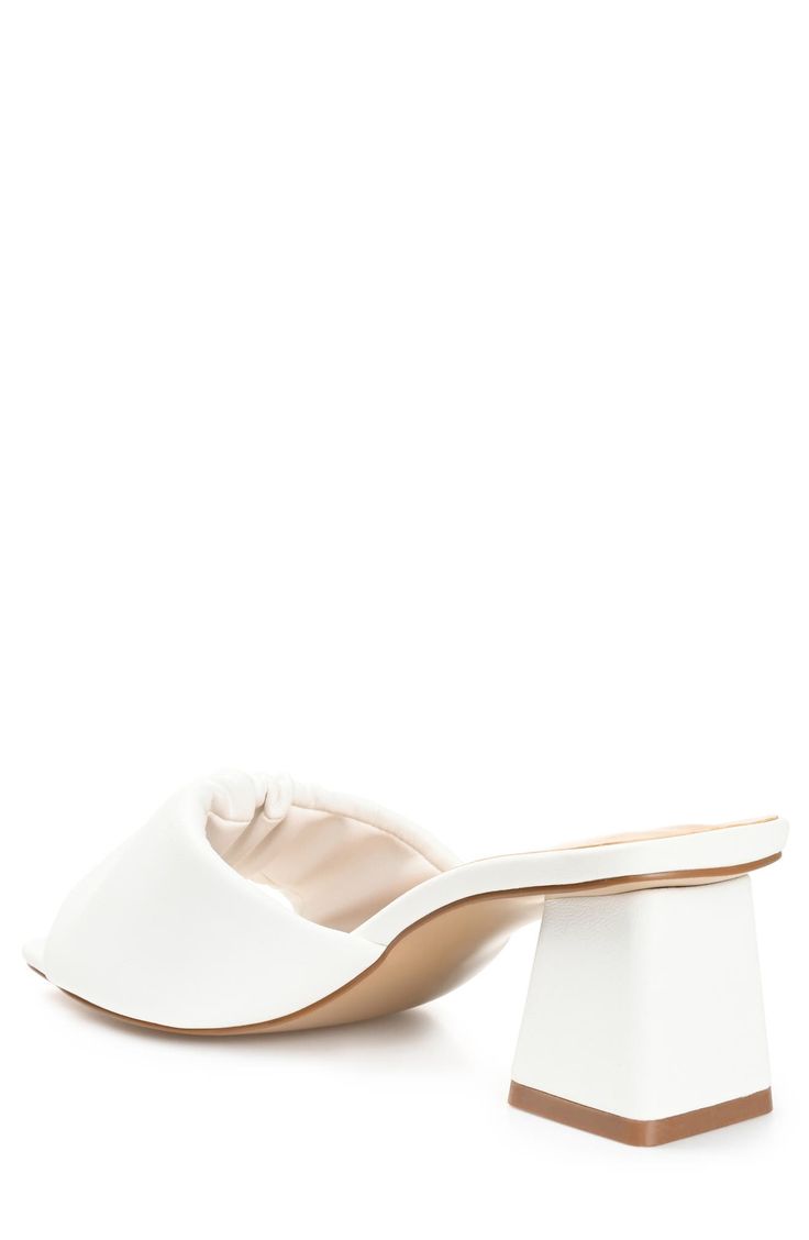 Slip into style with this heeled mule sandal that is perfect for any occasion. 2" heel Open toe Slip-on style Vegan leather upper/synthetic sole Imported Chic Slip-on Block Heels With Padded Heel, Spring Formal Slides With Sculpted Heel, Formal Slides With Sculpted Heel For Spring, Spring Mules With Wooden Heel And Slip-on Fit, Chic Slides With Sculpted Heel And Round Toe, Chic Slip-on Mules With Low Heel, Chic Slides With Sculpted Heel, White Open Heel Mules With Padded Heel, Spring Low Heel Mules With Wrapped Heel