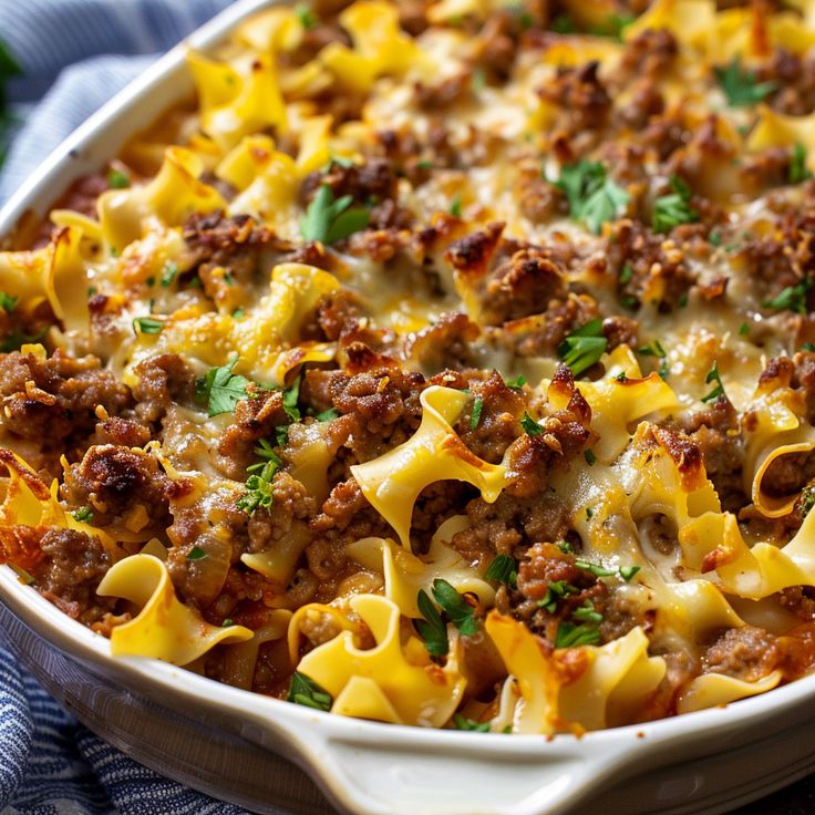 a casserole dish filled with meat and cheese