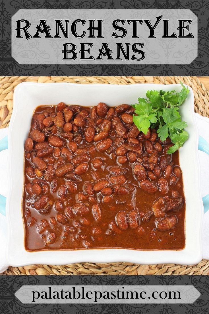 a white plate topped with beans covered in sauce