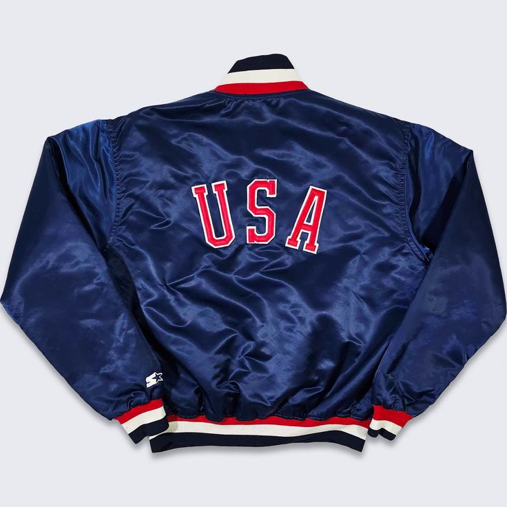 USA Vintage 80s Starter Satin Bomber Jacket   Navy Blue Color Athletic Coat Stitched on Logo & Letters Made in USA In Excellent Vintage Condition No Holes or Stains Size Men's L Please Check Your Measurements Measurements: Length: 26 in Pit to pit: 26 in FREE AND FAST SHIPPING IN THE USA Navy Retro Varsity Jacket With Long Sleeves, Retro Blue Outerwear With Baseball Collar, Retro Blue Windbreaker For College, Navy Vintage Windbreaker For Streetwear, Retro Navy Outerwear With Long Sleeves, Retro Navy Long Sleeve Outerwear, Navy Retro Long Sleeve Outerwear, Blue College Track Jacket With Pockets, Blue Track Jacket With Pockets For College