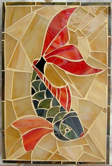 a fish is depicted on a stained glass tile wall art piece in red, yellow and green colors