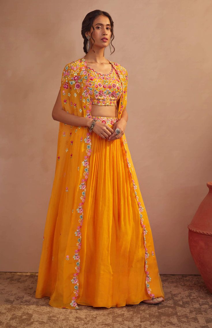 Aneesh Agarwaal-Mango Yellow Cape Skirt Set-INDIASPOPUP.COM Orange Indian Outfit, Aneesh Agarwaal, Haldi Dress For Bride, Haldi Dress Ideas, Haldi Outfit For Bride, Mehendi Dress, Cape Skirt, Haldi Ceremony Outfit, Cape Lehenga