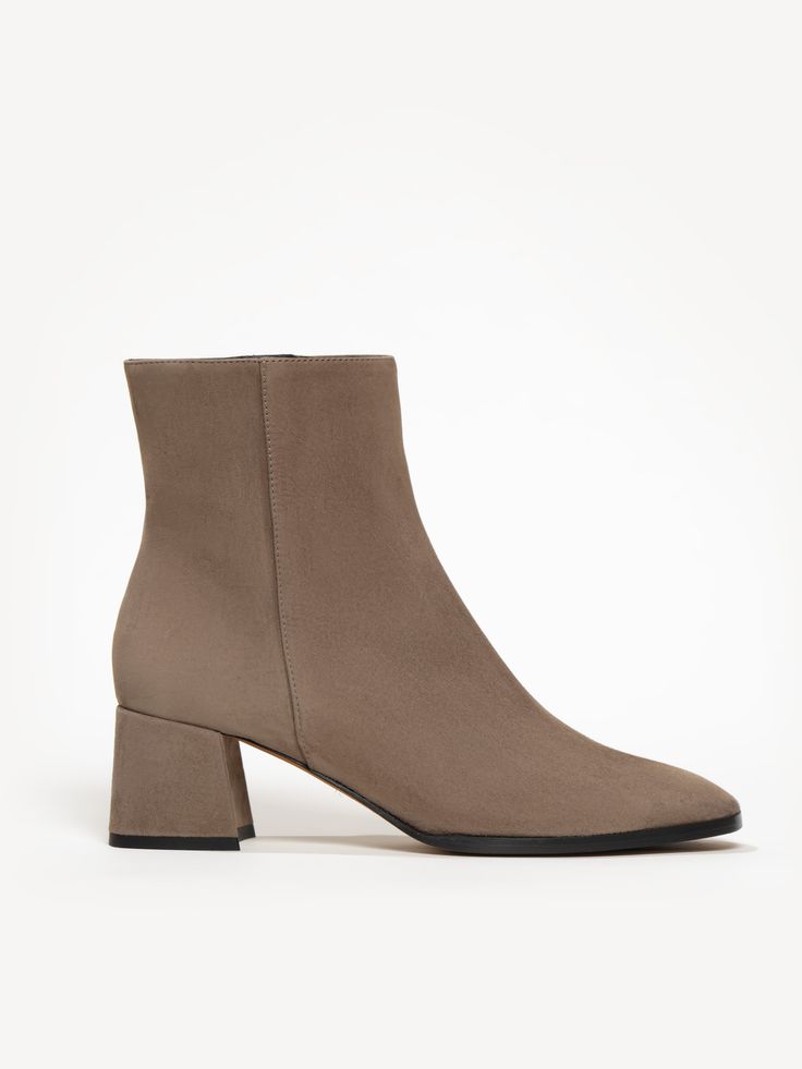 Crafted from soft suede, The Cristina bootie was designed with versatility in mind. Dress it up, dress it down, wear it with dresses, wear it with jeans. The classic silhouette—featuring an almond toe and walkable block heel—is essential to any cool-weather wardrobe. Square Toe Suede Heeled Boots For Fall, Suede Square Toe Heeled Boots For Fall, Fall Suede Boots With Square Toe, Fall Boots With Sculpted Low Heel, Suede Almond Toe Heeled Boots For Fall, Fall Suede Heeled Boots With Almond Toe, Suede Boots With Stacked Heel For Fall, Fall Heeled Boots With Sculpted Low Heel, Suede Boots With Sculpted Heel For Work