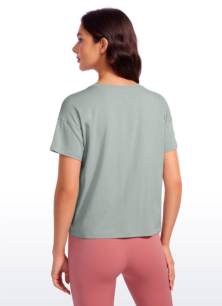 Pima Cotton collection is super soft and feels great against your skin, aiming to offer a comfortable feeling to you. Athletic short sleeve crop tops designed with a round neckline and flowy style for a simple and stylish look. Loose fit design allows you to move freely without restriction during exercise. Ideal for yoga, workout, and casual wear. Feature & Fitting: 
 Pima Cotton collection 
 Design for low-impact workouts or daily wear 
 Relaxed fit for moving freely 
 Round neck, hip lengt Cropped Short Sleeve T-shirt For Summer Loungewear, Boxy Short Sleeve Basic Cropped T-shirt, Short Sleeve Crew Neck Top For Loungewear, Basic Cropped T-shirt For Loungewear, Casual Summer Tops With Soft Texture, Relaxed Short Sleeve T-shirt For Relaxation, Comfortable Solid Color Tops For Relaxation, Cropped T-shirt For Summer Loungewear, Relaxed Solid Color Short Sleeve T-shirt