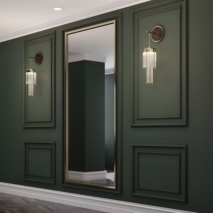 an empty room with green walls and gold framed mirrors on the wall, along with wooden flooring