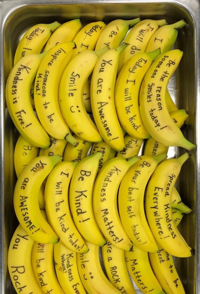 a bunch of bananas with writing on them in a metal container that says, i love you to the moon and back