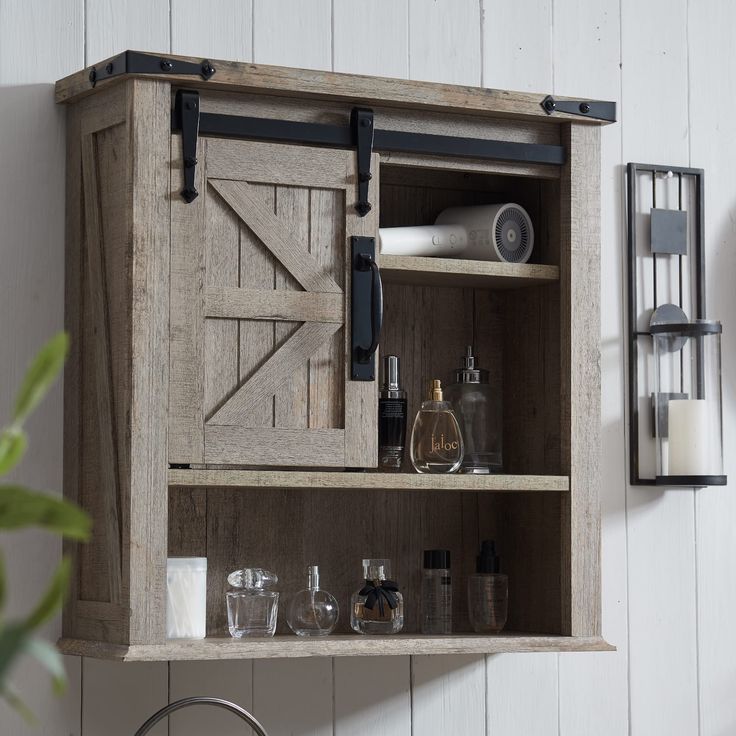 PRICES MAY VARY. [BATHROOM ORGANIZER] 23.5"L × 7.8"W × 24"H, This elegant wall-mounted storage cabinet is a versatile and practical way to save precious floor space in your lovely bathroom, generating a space for small toiletries and bathroom clutter [FARMHOUSE RUSTIC STYLE] Made of a blend of sturdy engineered wood with weathered natural wood grain for an abundance of classic farmhouse aesthetic. The sliding barn door with smooth railing tracks could not only ensure the simple pulling convenien Farmhouse Medicine Cabinet, Farmhouse Medicine Cabinets, Storage Cabinet Wall, Bathroom Cabinets Over Toilet, Bathroom Wall Cabinet, Wall Mounted Bathroom Cabinets, Bathroom Cabinet Organization, Over Toilet, Bathroom Wall Cabinets